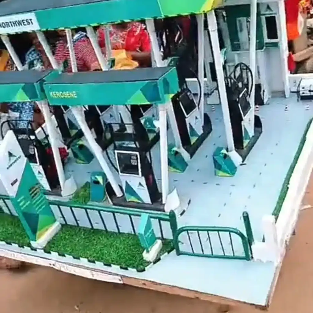 Nigerian Man Constructs a Filling Station Using Carton and Hose1