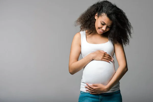 cheerful pregnant african american girl