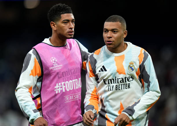 MADRID, SPAIN - JANUARY 22: Jude Bellingham of Real Madrid interacts with teammate Kylian Mbappe as they warm up prior to the UEFA Champions League 2024/25 League Phase MD7 match between Real Madrid C.F. and FC Salzburg at Estadio Santiago Bernabeu on January 22, 2025 in Madrid, Spain. (Photo by Angel Martinez/Getty Images)