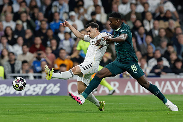 Real Madrid's Moroccan forward #21 Brahim Diaz (L) vies for the ball with Manchester City's English defender #15 Marc Guehi during the UEFA Champions League last 16 first leg football match between Real Madrid CF and Manchester City at Santiago Bernabeu Stadium in Madrid on March 11, 2026. (Photo by Oscar DEL POZO / AFP via Getty Images)