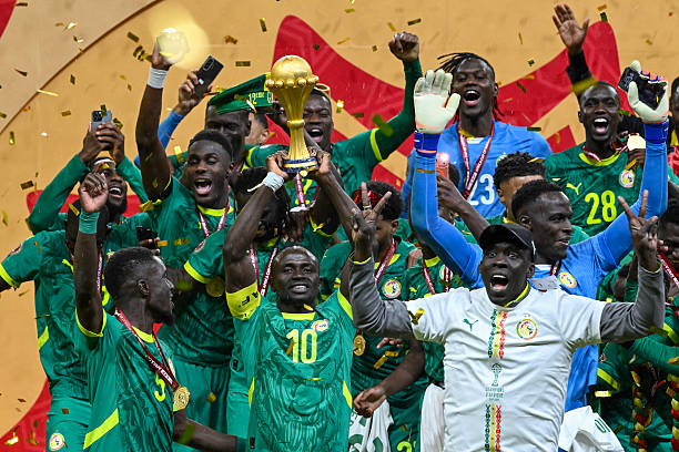 TOPSHOT - Senegal's forward #10 Sadio Mane holds the trophy after the Africa Cup of Nations (CAN) final football match between Senegal and Morocco at the Prince Moulay Abdellah Stadium in Rabat on January 18, 2026. (Photo by SEBASTIEN BOZON / AFP via Getty Images)