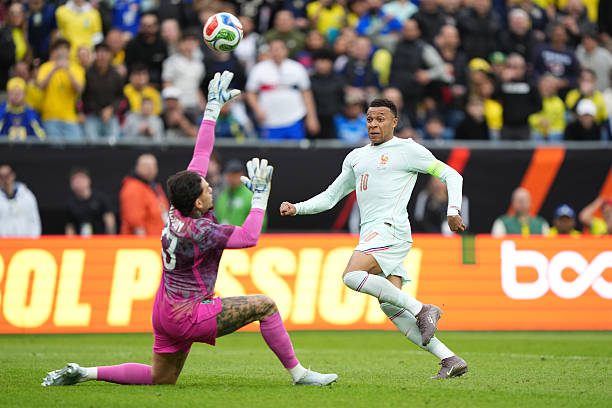 France Edge Brazil in Thrilling Friendly Despite Red Card Drama 2 FOXBOROUGH, MASSACHUSETTS - MARCH 26: Kylian Mbappe of France scores the team's first goal during the international friendly match between Brazil and France at Gillette Stadium on March 26, 2026 in Foxborough, Massachusetts. (Photo by Michael Owens/Getty Images)