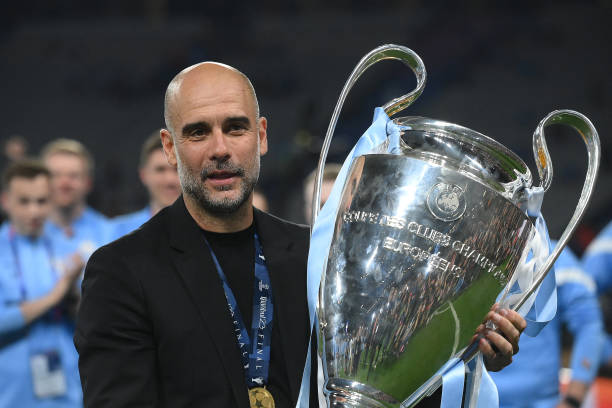 TOPSHOT - Manchester City's Spanish manager Pep Guardiola celebrates with the European Cup trophy after winning the UEFA Champions League final football match between Inter Milan and Manchester City at the Ataturk Olympic Stadium in Istanbul, on June 10, 2023. (Photo by FRANCK FIFE / AFP) (Photo by FRANCK FIFE/AFP via Getty Images)