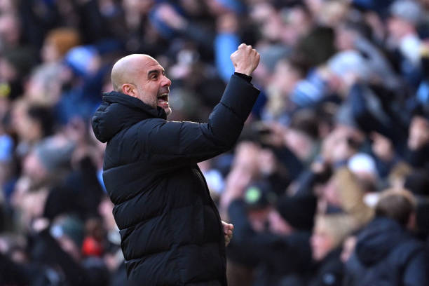 Pep Guardiola, Manager of Manchester City, celebrates after Erling Haaland scores the team's first goal during the Premier League match between Manchester City and Liverpool FC at Etihad Stadium on November 25, 2023 in Manchester, England. (Photo by Michael Regan/Getty Images)